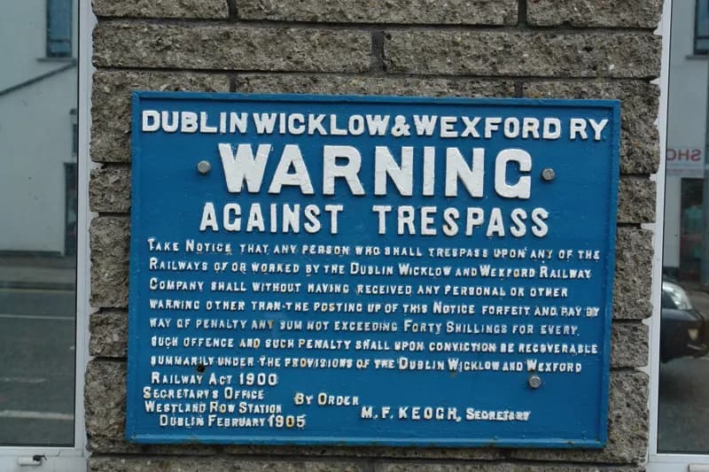 Blue enamel Dublin Wicklow and Wexford Railway warning against trespass.