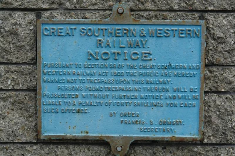 Pale blue enamel notice of the Great Southern and Western Railway.